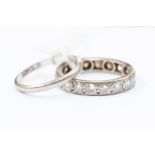 A diamond and platinum set eternity ring, grain set with brilliant cut diamonds, with a total