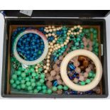 A collection of various vintage bead necklaces to include carved rose quartz, turquoise, mille fiori