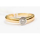 A diamond and 18ct gold solitaire diamond ring, collet set round brilliant cut diamond of approx 0.