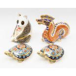 Four Royal Crown Derby paperweights including a Chinese dragon, panda, terrapin and another terrapin