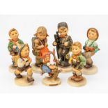 A collection of Goebel figures, comprising 'Village Boy', 'School Boy', 'Happy Traveller', '