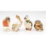 Four Royal Crown Derby paperweights including a white pelican, owl, kingfisher and puffin CR all