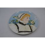 An early 20th Century Minton style plate hand painted with a Lady wearing a bonnet with prunus