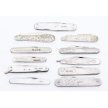 An assembled group of eight Edwardian and later silver pocket knives, three undecorated, one