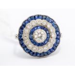 A sapphire and diamond platinum dress ring, the circular form set to the centre with an old cut