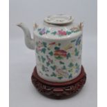 A Chinese 19th Century Famille Rose teapot and cover, 15cm high, complete with associated wooden