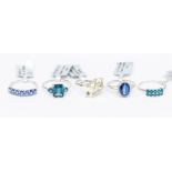 A collection of 9ct white gold rings to include a London blue topaz ring, total carat weight approx.