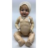 Kammer & Reinhardt: An early 20th century bisque head doll, marked to head 'K*R Simon & Halbig 126',