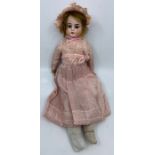 Heubach: An early 20th century, Ernst Heubach, bisque head doll, fixed eyes, open mouth, revealing