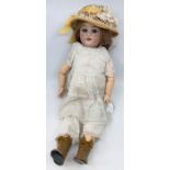 An early 20th century bisque head doll, with painted eyebrows, sleep eyes, open mouth, revealing