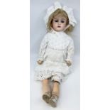 A late 19th/early 20th century bisque head doll, with painted eyebrows, sleep eyes, open mouth