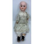 Armand Marseille: A late 19th century bisque head doll, marked to the back of the head '1894 AM