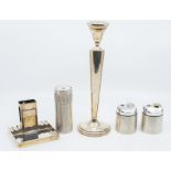 A collection of silver to include: an Art Deco silver combination match box holder and ashtray, by