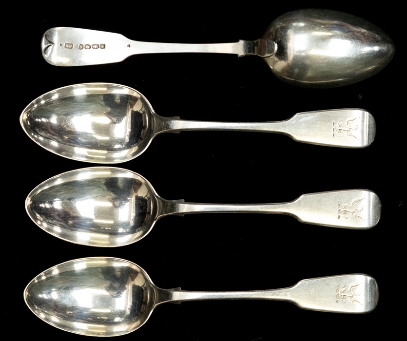 A set of ten early Victorian provincial silver fiddle pattern dessert spoons, each engraved with a