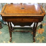 A mid Victorian walnut ladies work table, the top veneered burr amboyna with ebony banding and a