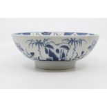 A Worcester punch bowl, circa 1780-85, of plain rounded form and painted in blue with the 'Late Rock