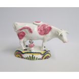 A North Country Cow Creamer and Milk Maid. Pink sponged decoration  and a rainbow decorated base