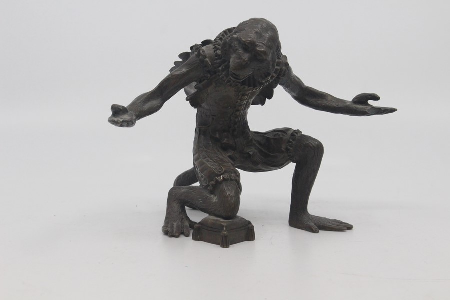 A Continental bronze figure of a monkey jester, possibly Austrian, late 19th Century, modelled in