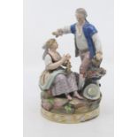 A Meissen figure group of rustic maid and gallant, 20th Century, modelled as a seated maid playing a