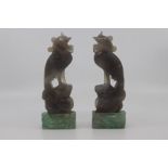 A pair of Chinese carved agate figures of phoenix birds, Qing Dynasty, 19th Century, of pale grey