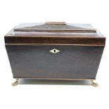 A Regency mahogany tea caddy, stamped Gillows, Lancaster, fitted interior with a central mixing bowl