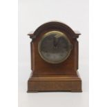 A late Edwardian Lenzkirch walnut bracket style mantel clock, with arch-top case, the silvered