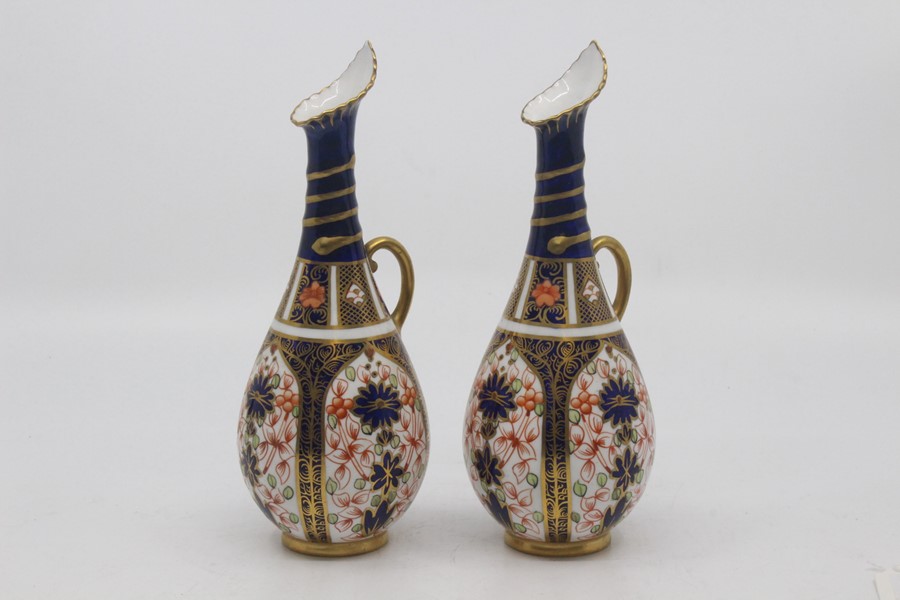 A pair of Royal Crown Derby Imari ovoid ewers, dated 1922, decorated with pattern 1128, 18.5cm high.