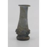 A Roman glass vase, 1st-2nd Century AD, of pale blue hue, ovoid form with everted folded rim, the