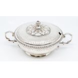 An Edwardian silver two handled small tureen and cover, gilt lined, the body with fluted sections