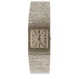 A Universal 18ct white gold ladies wrist watch, the rectangular dial approx. 18 x 21mm, silvered