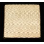 A 9ct gold mirror compact, square form with textured decoration, with powder puff, size approx. 50mm