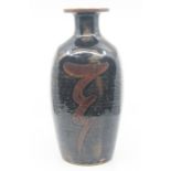 A large tenmoku glazed vase by David Leach, of squared cut sided form and decorated with a deep