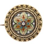 An early 20th Century silver gilt and enamel brooch, the circular domed design adorned with floral