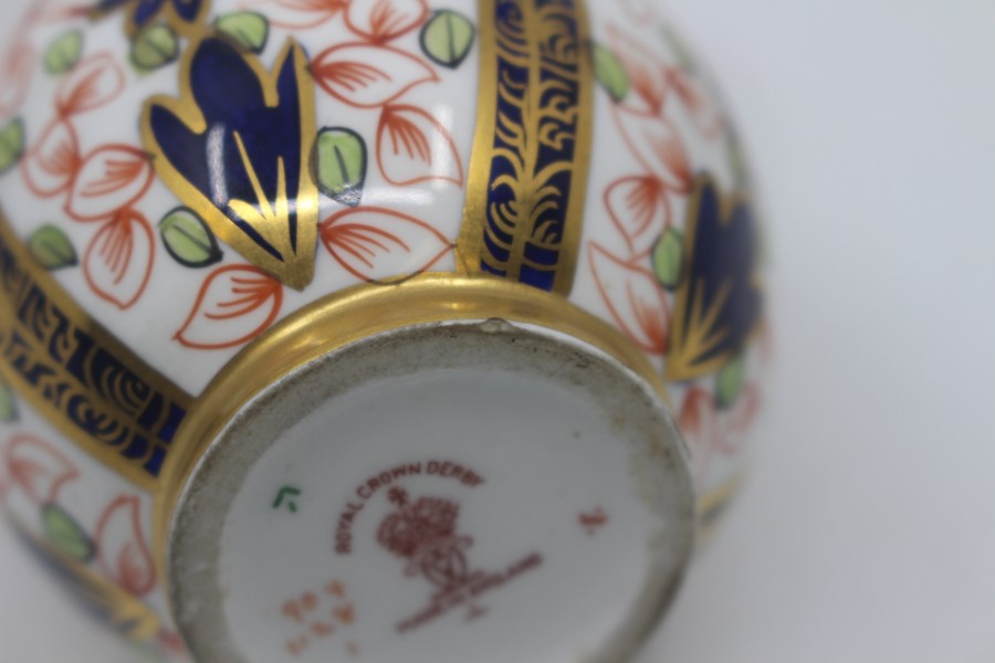 A pair of Royal Crown Derby Imari ovoid ewers, dated 1922, decorated with pattern 1128, 18.5cm high. - Image 3 of 4