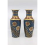 A pair of Japanese earthenware vases, late Meiji period, of tapering form and decorated with '