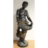 A large Goldscheider terracotta Blackamoor figure of a bare breasted nubile, standing holding a