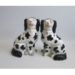 A pair of Staffordshire ‘Disraeli Curls; Black and White Seated Spaniels Date circa 1850 Size: 19.
