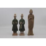 Three Chinese pottery funerary figures, Han Dynasty, including a pair of standing attendants in long