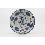 A Worcester dessert plate, circa 1775, of lobed circular shape and painted in blue with the '