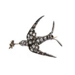 A late Victorian diamond set swallow brooch, comprising bird in flight chasing an insect, the body