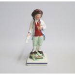 An English Pottery figure of a Paper Seller, standing on a square base  Date: circa 1790-1800