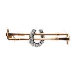 Hunting interest- a rose gold stock pin in the form of a double riding crop with applied diamond set