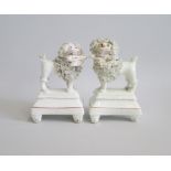 A Pair of Staffordshire ‘Lion Clipped’ Poodles  standing on footed oblong tiered plinths. Both