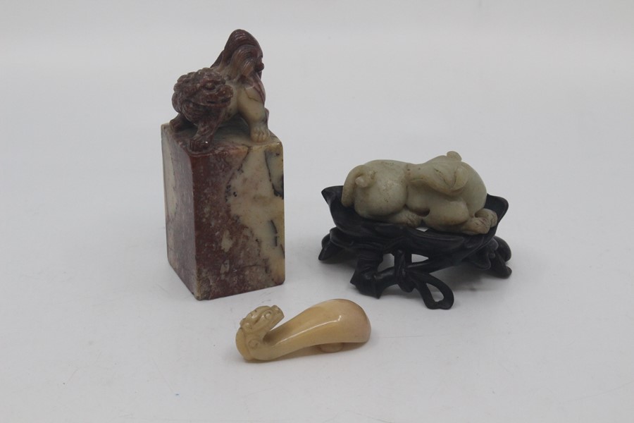 A Chinese carved soapstone seal, late 19th Century, of pink-veined and pale grey hue, carved with