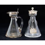 A pair of Edwardian silver mounted cut glass whiskey tots, one with Whiskey label on suspension