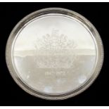 An Elizabeth II silver circular tray, beaded border engraved with Royal Arms and dates 1947-1972