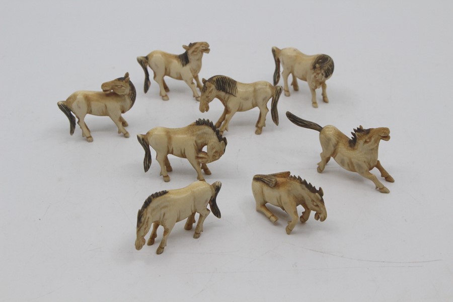 A set of eight Chinese carved ivory horses of Wang Mu, 19th Century, each carved naturalistically