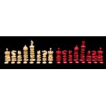 A late 19th Century turned bone Barleycorn chess set, red stained and natural and of typical form,