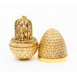 Stuart Devlin silver gilt surprise ' two love birds' egg, decorative textured form opening to reveal