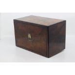 An Edwardian walnut cross-banded revolving cigar case, circa 1910, of rectangular outline with